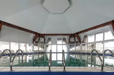 An indoor pool is seen. Merit Mechanical provides Pool Dehumidification