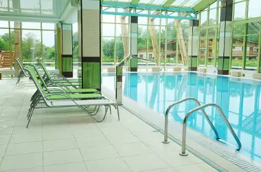 An indoor pool is seen. Merit Mechanical provides Pool Dehumidification.