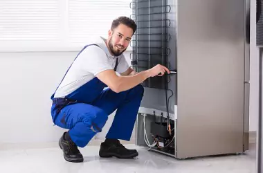  A technician is seen working on a commercial refrigerator. Merit Mechanical provides Commercial Refrigeration Repair in Chillicothe IL. 